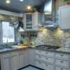Remodeled kitchen with Glass hand fused tiles